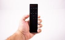 Contemporary clicker held by crop person
