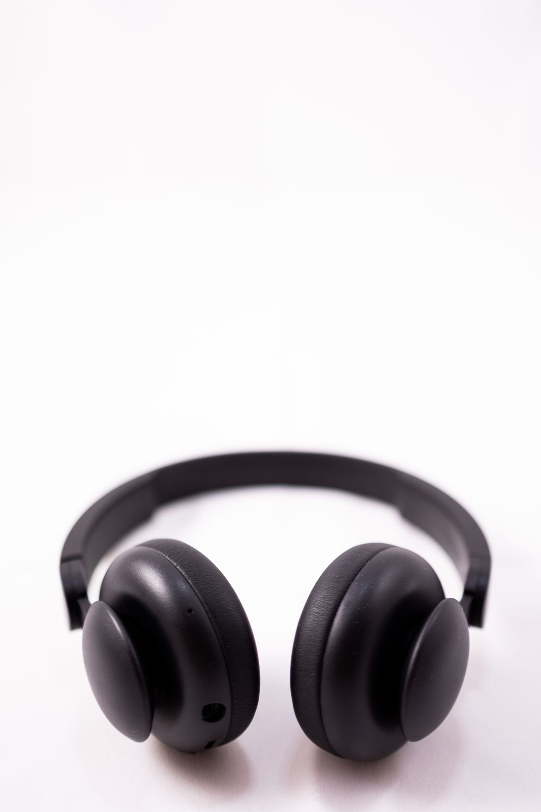 Black wireless headphones on a white background