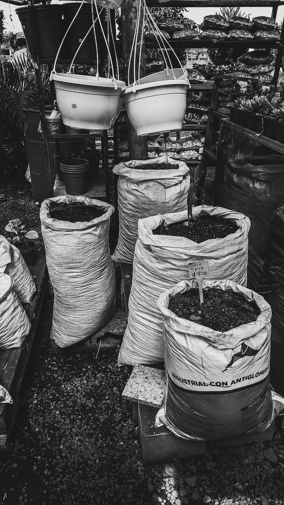Person holding a retro-style game controller in front of a TV playing a classic-looking game