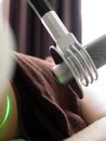 Patient having laser treatment for body shaping in contemporary clinic