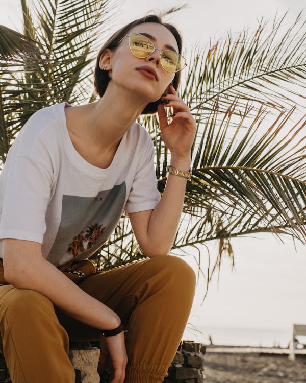 Free Stylish woman on beach with palm Stock Photo