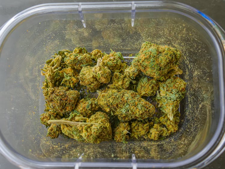 Photo Of Cannabis Flowers On Glass Container