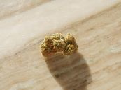 Close-Up Photo of Cannabis Flower on Top of Wooden Surface