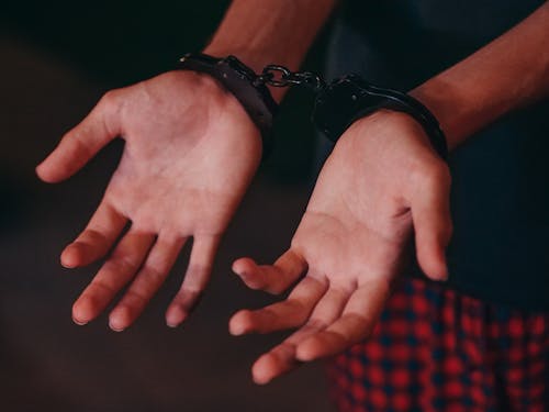 Free A Person in Handcuffs  Stock Photo