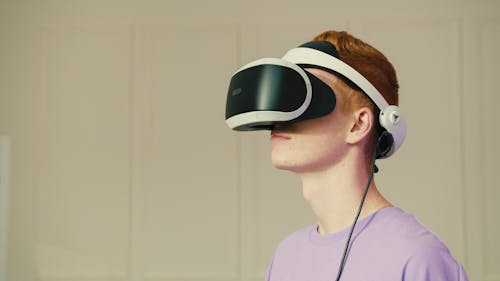 Close-Up Shot of a Man Wearing VR Glasses