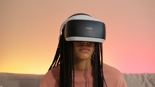 Teenager with Braids in PS VR Headset