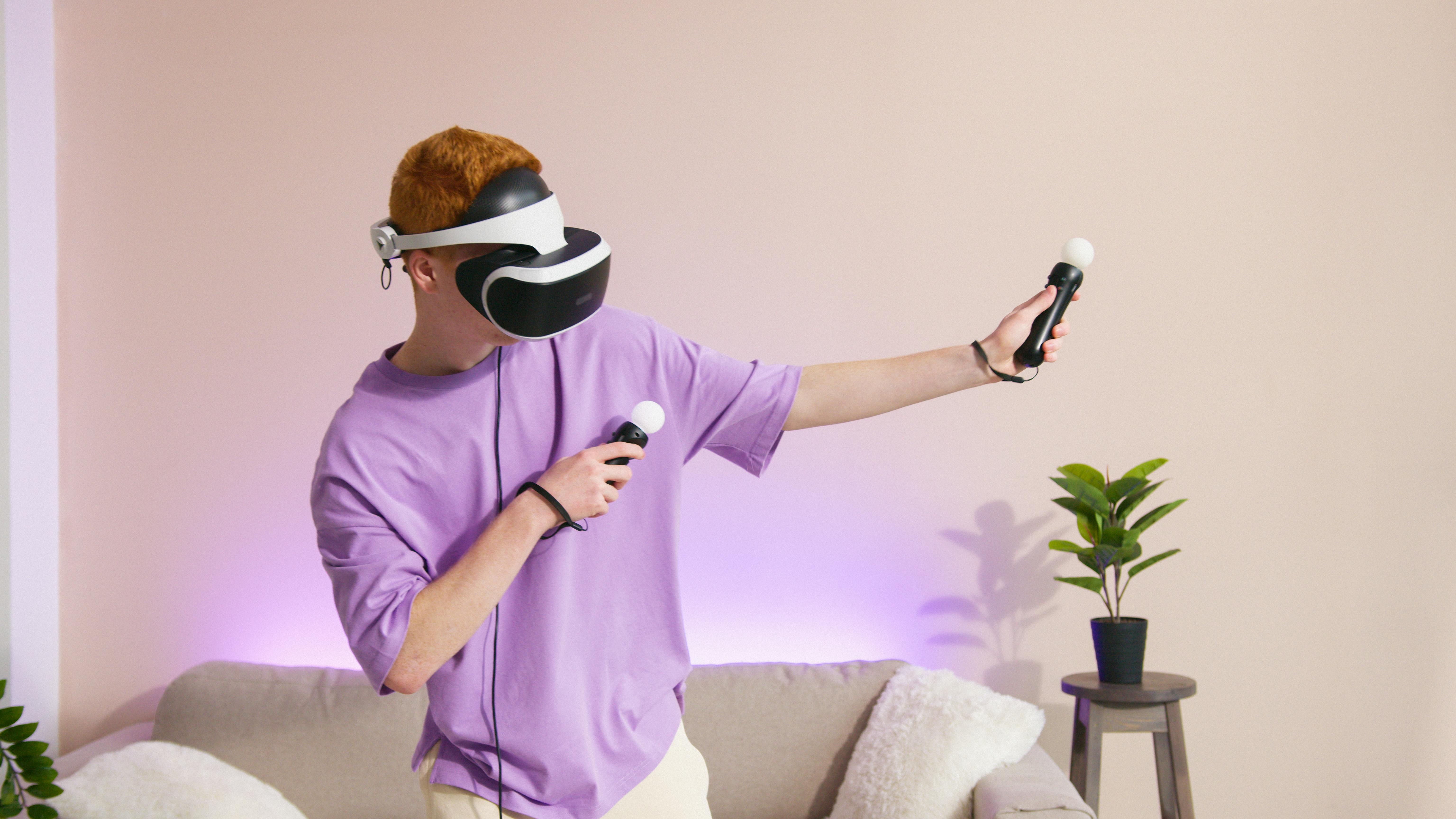 a person paying a video game while wearing a vr headset