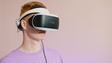 Close-Up Shot of a Man Wearing VR Glasses