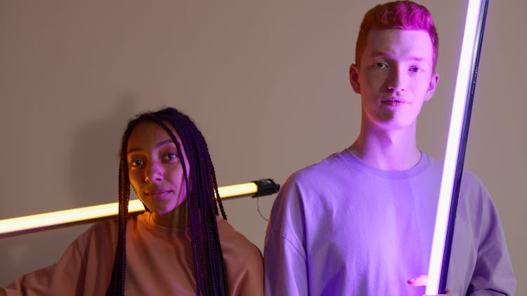 A Couple Holding Led Tube Lights