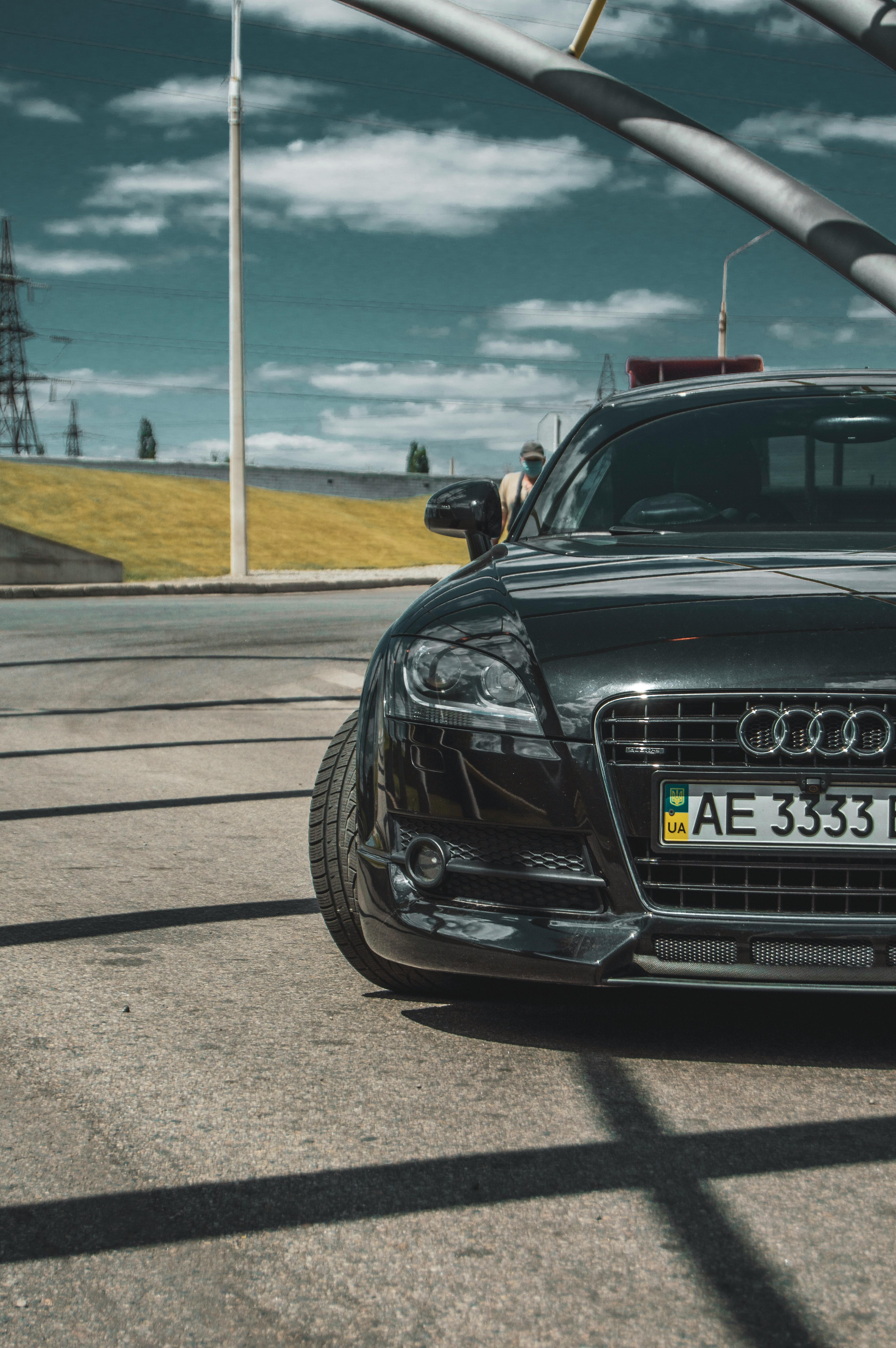 Green Audi Sports Car Parked in the Middle of the Road · Free Stock Photo Green Audi Sports Car Parked in the Middle of the Road · Free Stock Photo