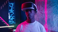 Man Wearing White Crew Neck Shirt and Virtual Headset