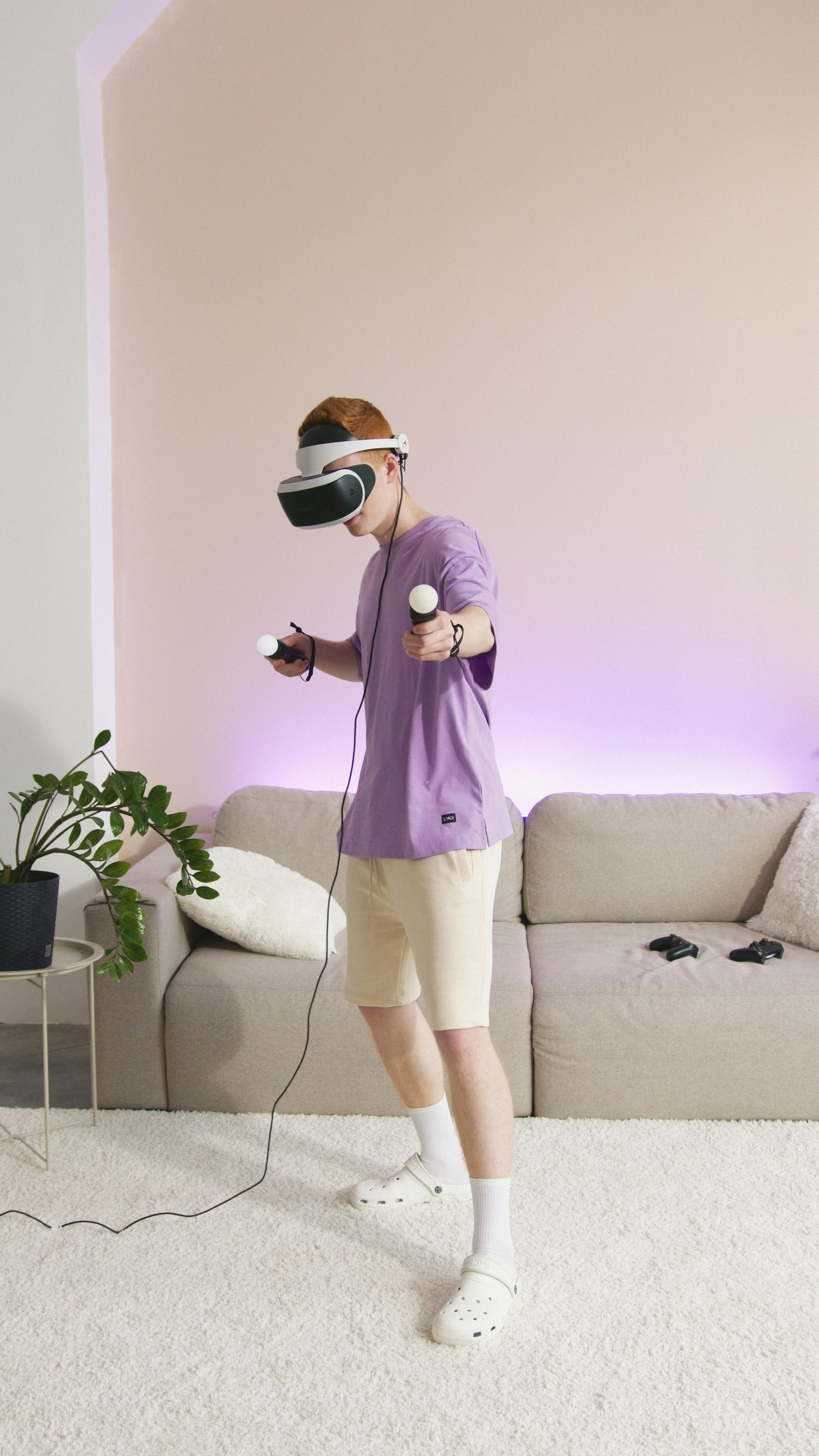 person in purple shirt playing playstation vr