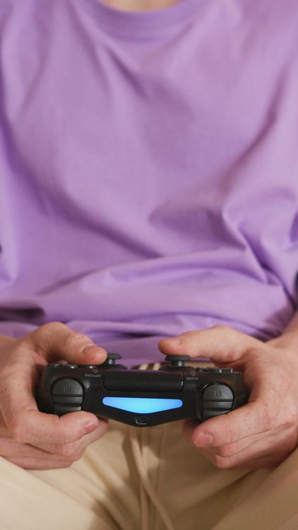 Free Close-up of hands holding a wireless game controller, perfect for gaming themes. Stock Photo