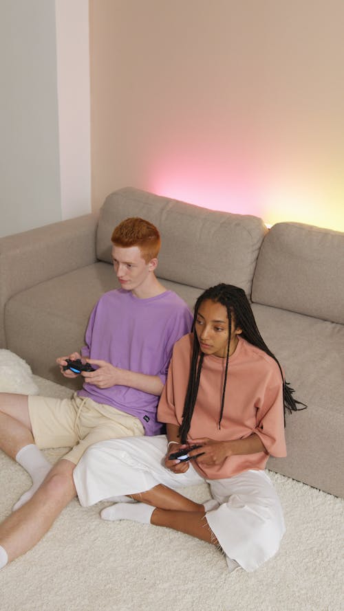 Man and Woman Playing a Video Game Together
