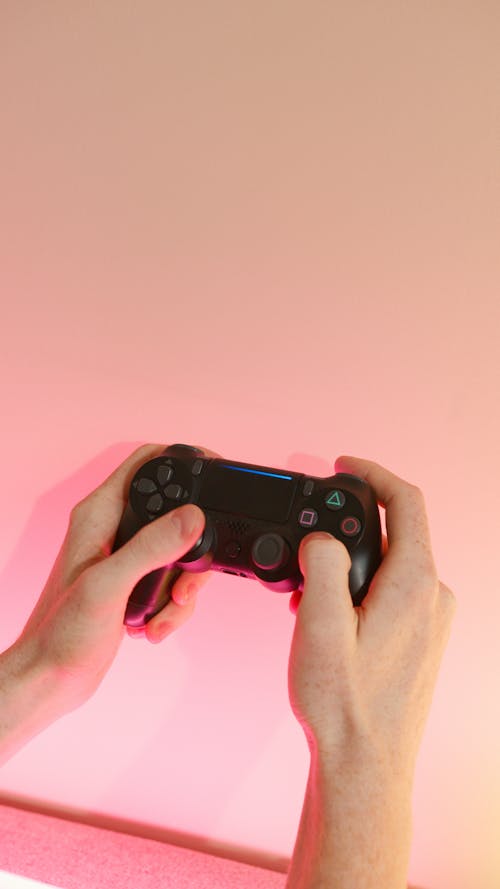 Free Person Holding Wireless Controller Stock Photo