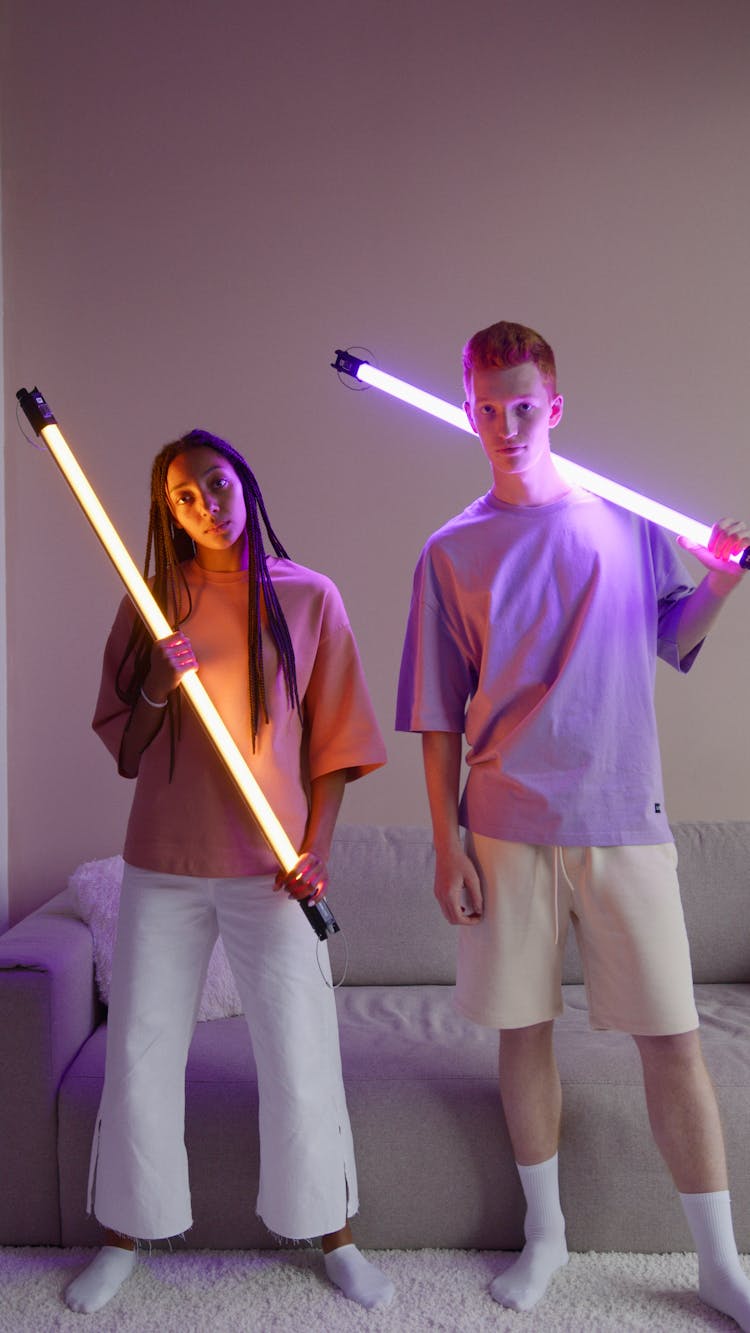 Man And Woman Holding Led Lights