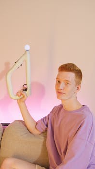 Teenage redhead capturing indoor gaming moment with unique controller.