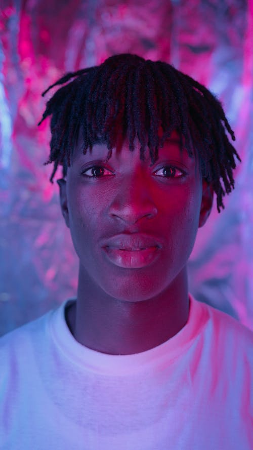 Man in White Crew Neck Shirt in Close Up Photography