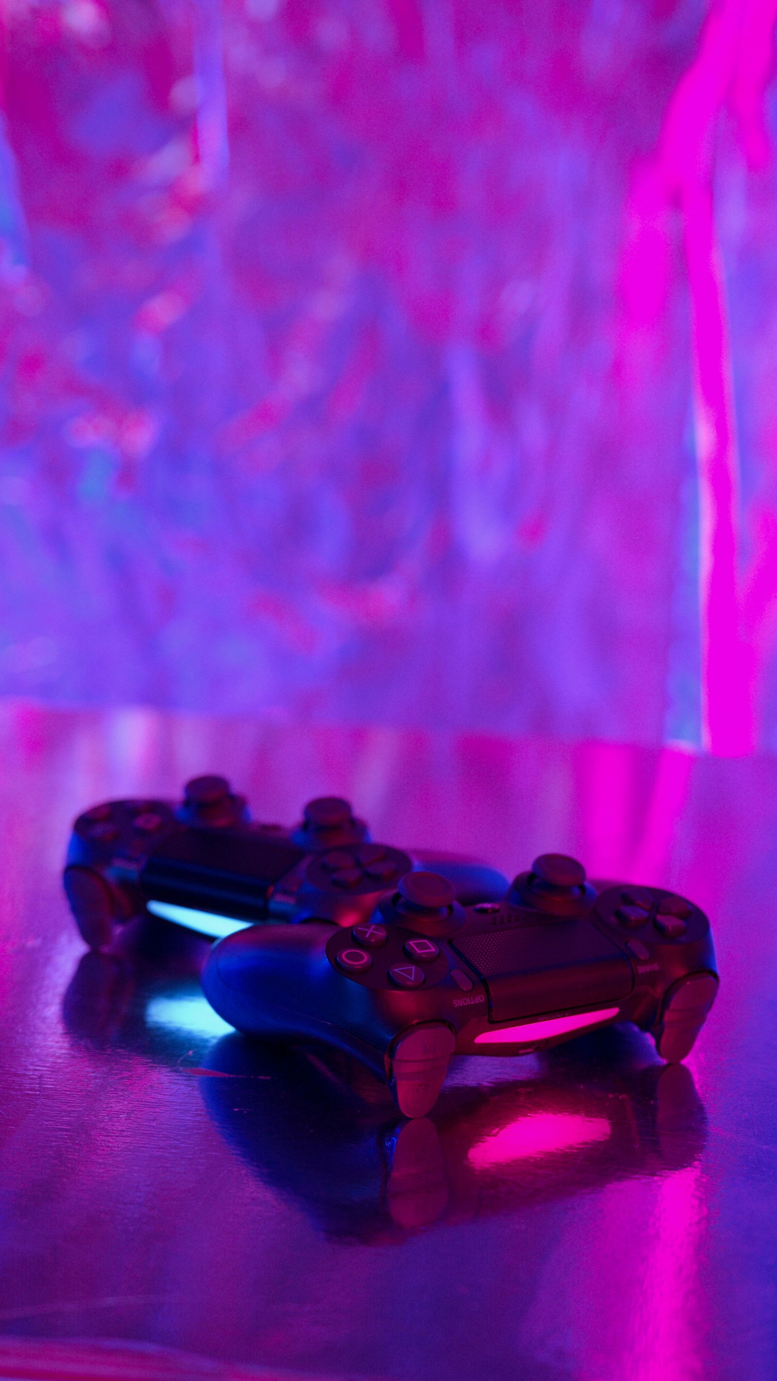 Gaming controllers under neon light