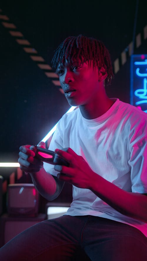 Free A Man Holding a Game Controller Stock Photo