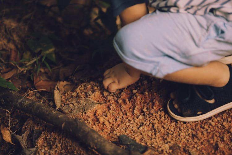 Crop Kid Touching Clay Soil