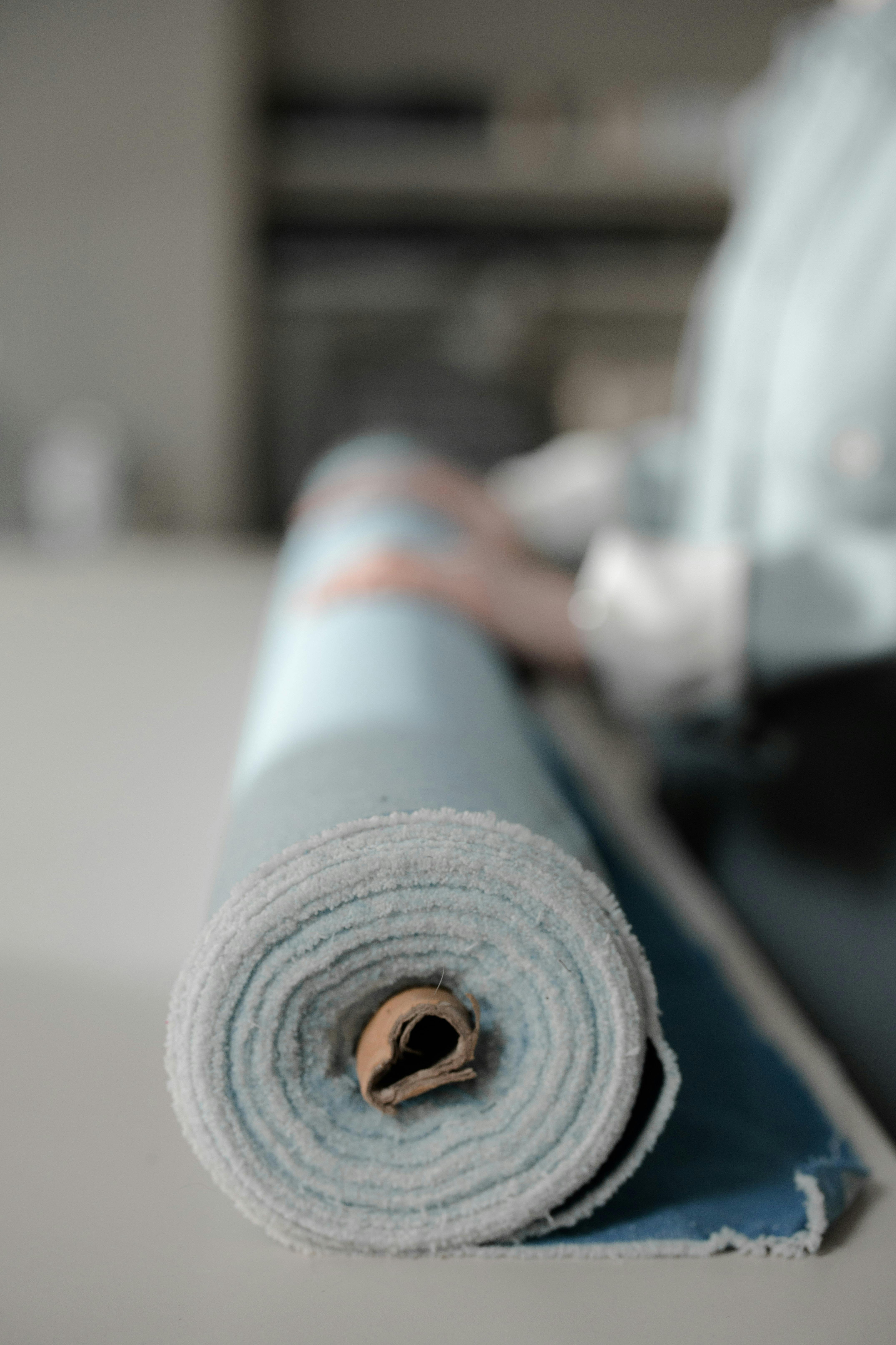 Textile worker operating machinery in a clothing factory