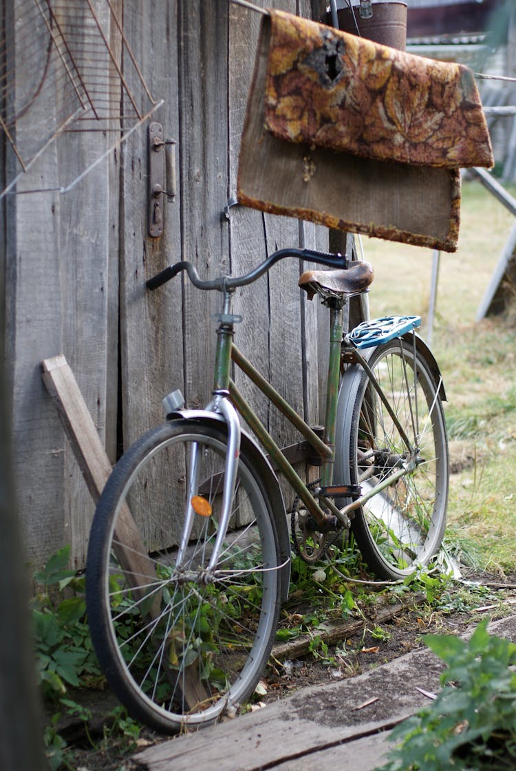 Bike Leaning On Wooden Wall