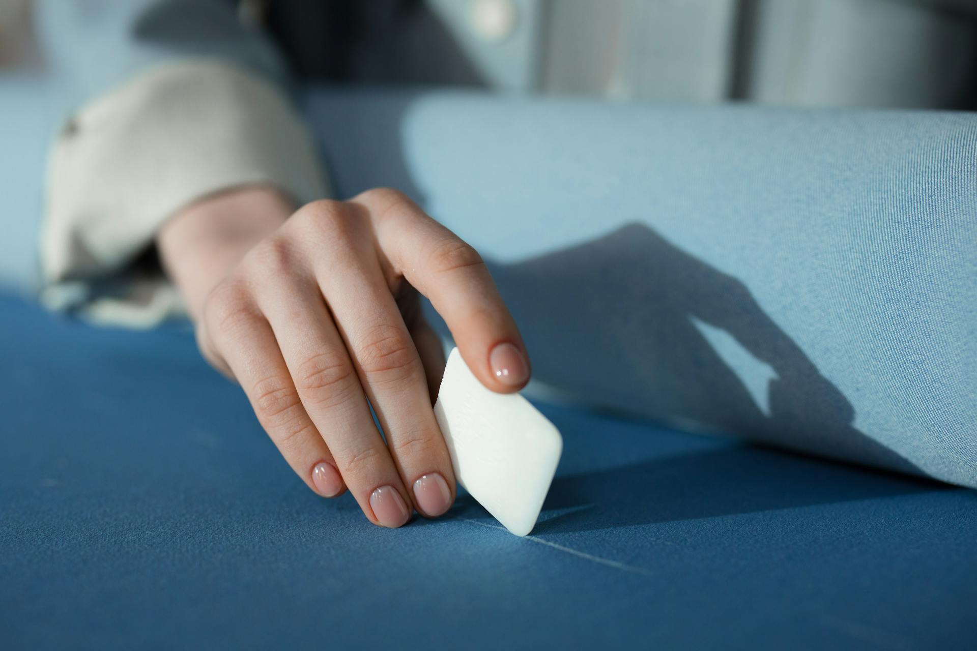 Person Using A Tailor's Chalk On Fabric