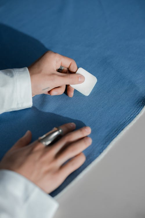Person Using A Tailor's Chalk On Fabric