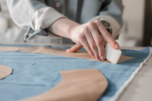 Free A Person Marking a Fabric Using a Tailor's Chalk Stock Photo