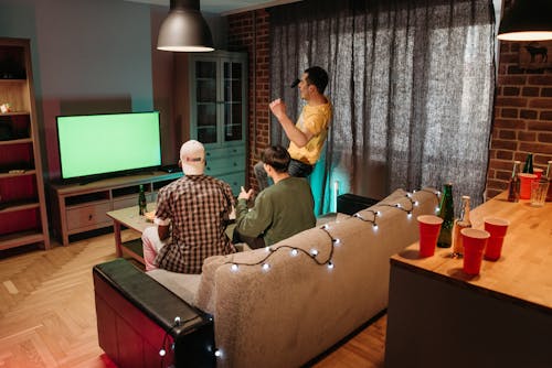 A Group of Men Having Fun Playing Video Games