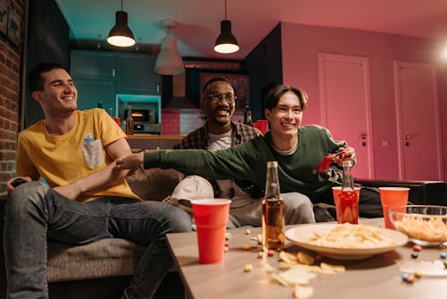 Happy Friends hanging out Together and eating Pizza · Free Stock Photo