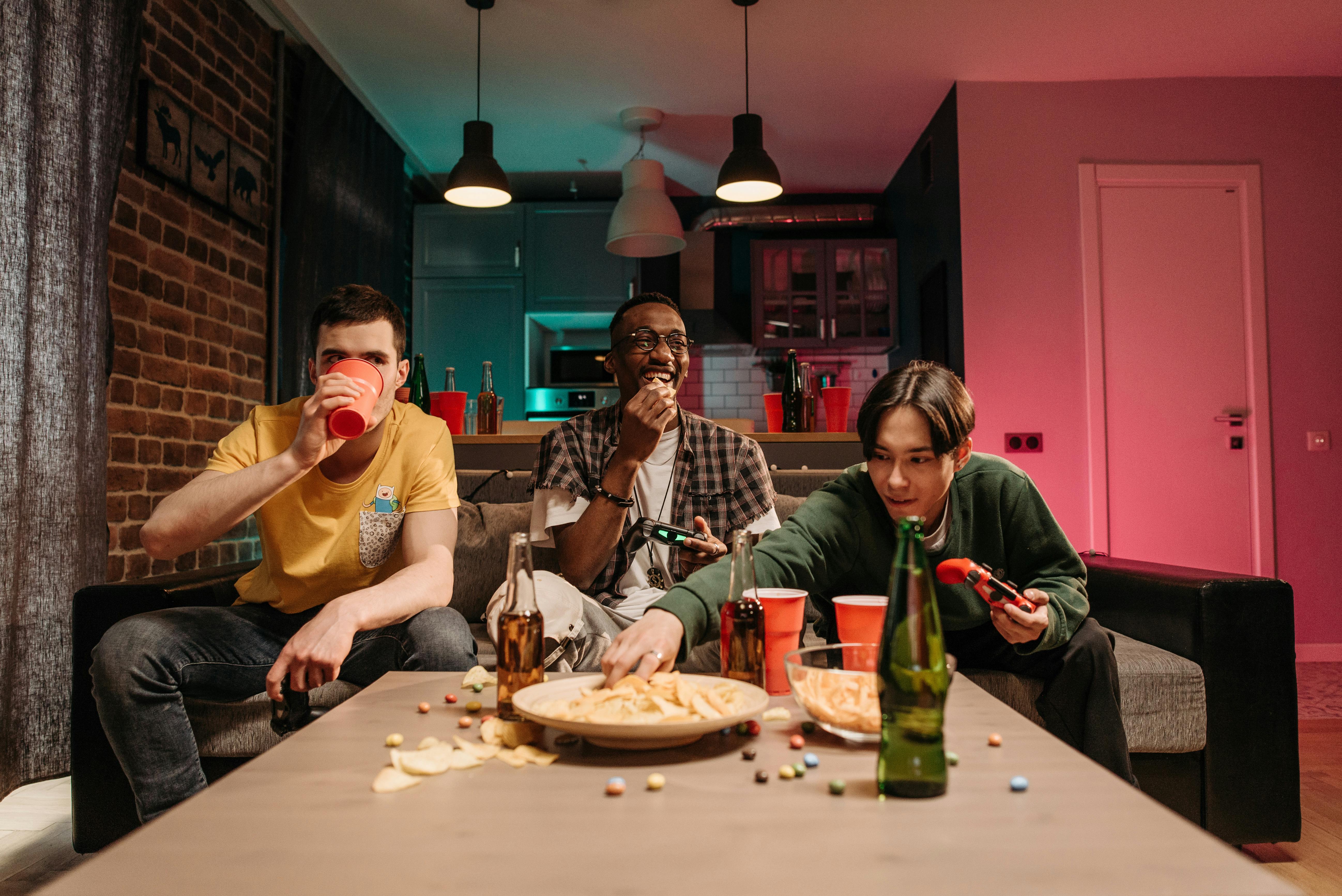 Happy Friends hanging out Together and eating Pizza · Free Stock Photo