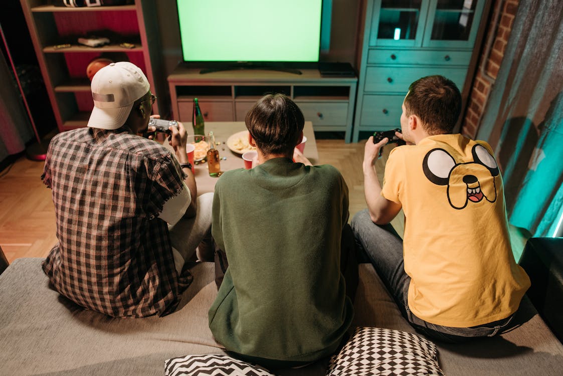 Free Friends Playing Video Game at Home Stock Photo