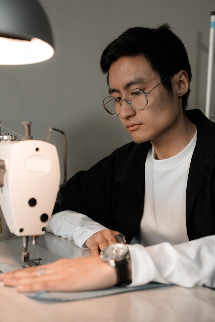 Man Using A Sewing Machine