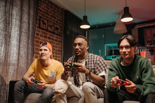 Three friends enjoy a fun gaming session together on a cozy sofa, focused and smiling.