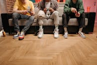 Group of Friend Playing a Game Console