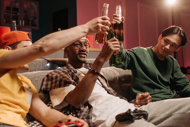 Friends Toasting Their Beer Bottles