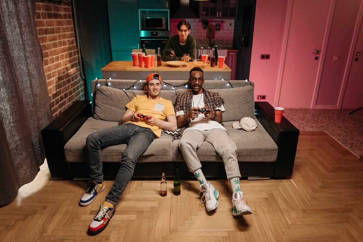 Friends playing games together on a sofa — photo by Pavel Danilyuk on Pexels