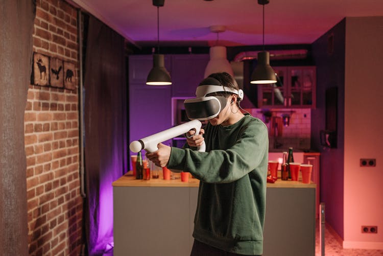 A Person Gaming While Wearing A VR Headset