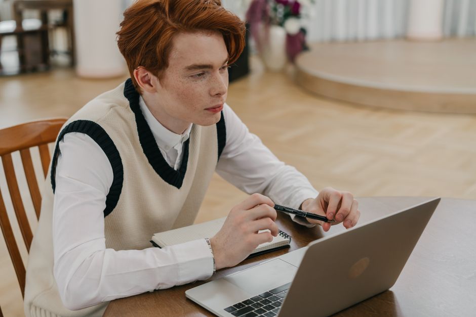Student consulting a digital insurance portal - travel insurance claim for students Student consulting a digital insurance portal - travel insurance claim for students