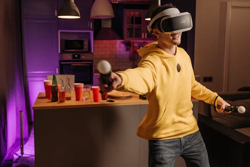 A Man Wearing a VR Headset Playing a Video Game