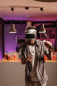 A young adult immersed in virtual reality gaming with a VR headset and controllers, in a cozy apartment setting.