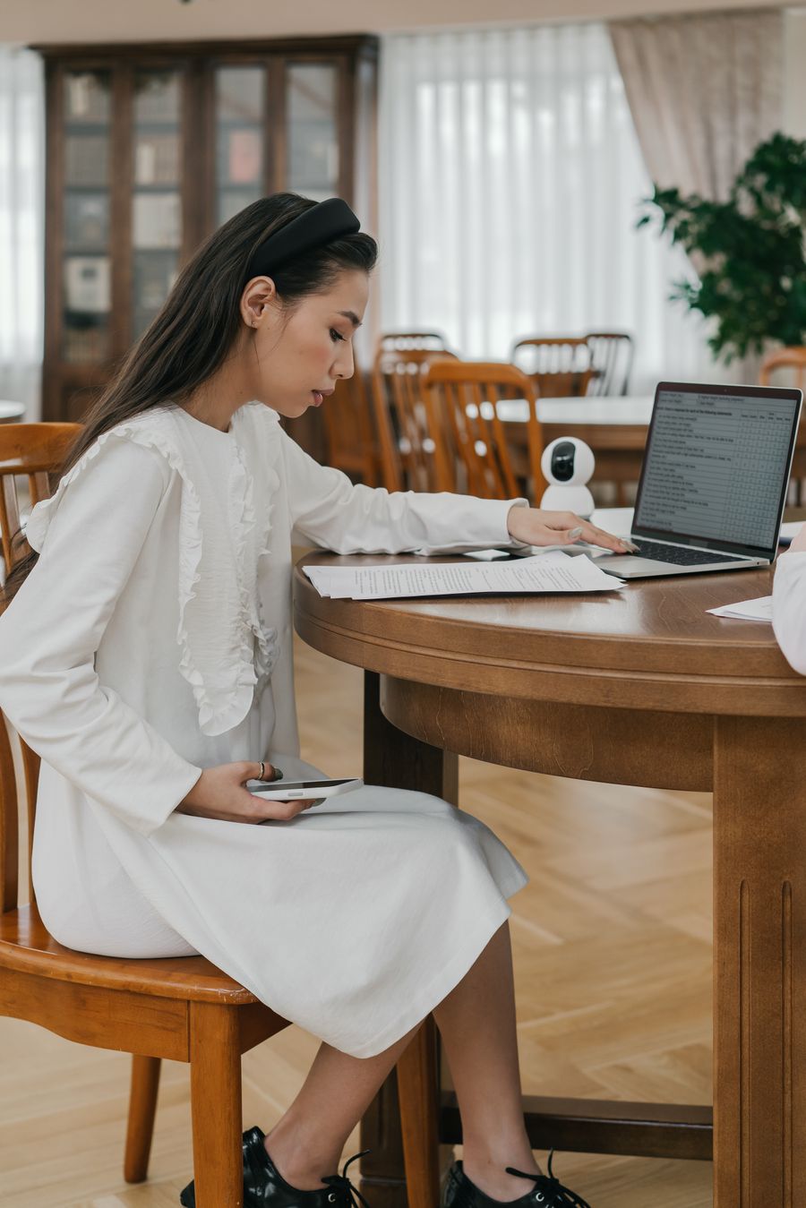 Professional learner reviewing an online course on a laptop