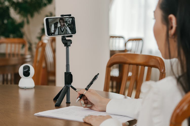 A Student Attending An Online Education Using The Smartphone