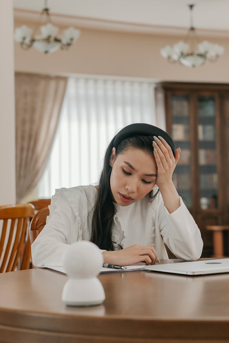 A Stressed Student Reading A Document