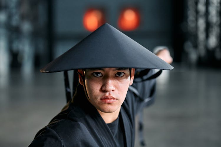 Man In Black Conical Hat