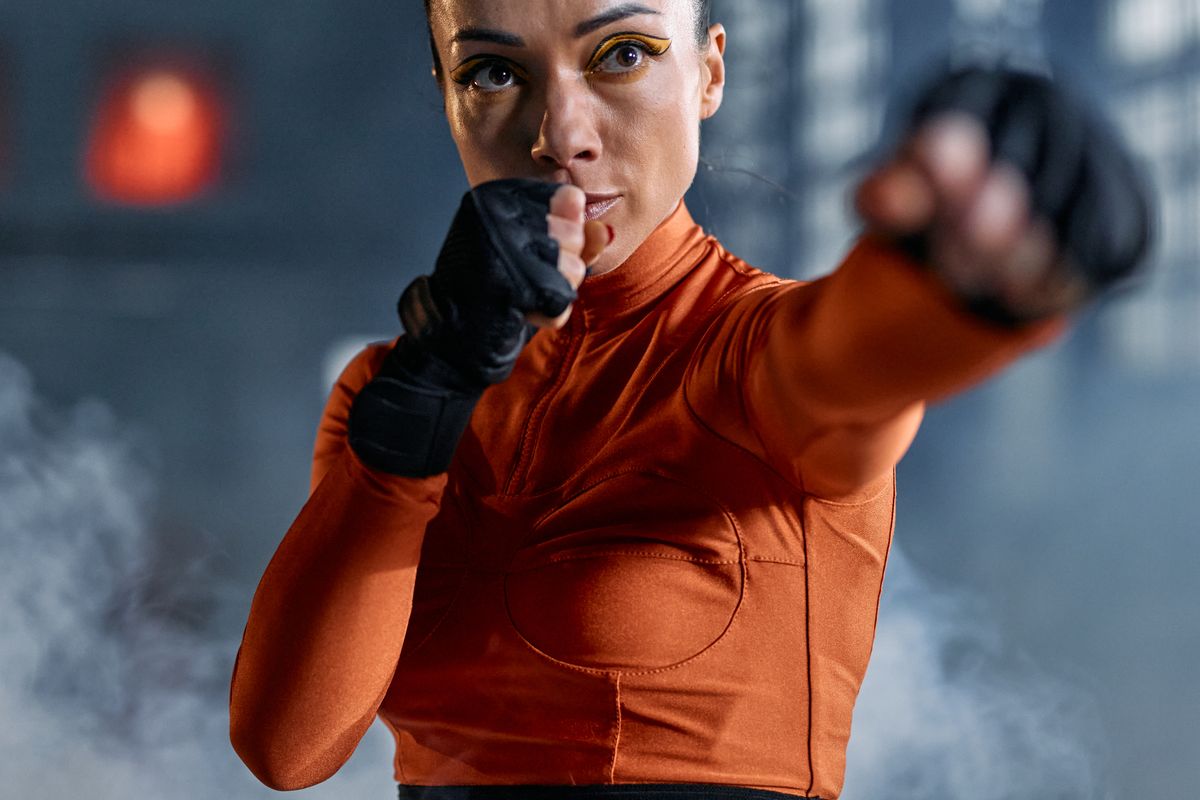 Female boxer demonstrating striking technique in the gym