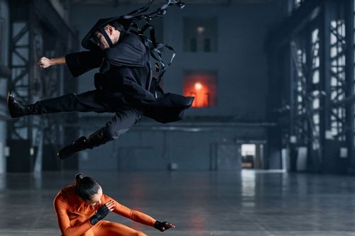 Free Stunning action shot of martial artists in cosplay, captured indoors with dramatic flair. Stock Photo