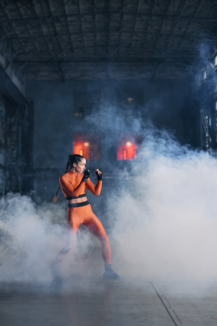 Woman In Black And Orange Costume